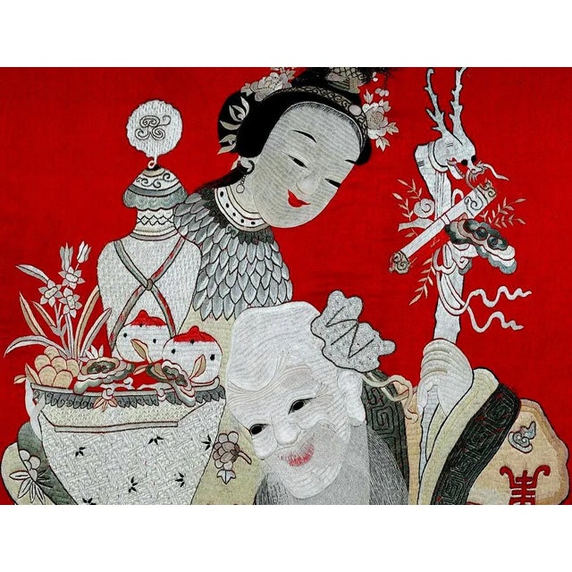 A large Chinese embroidery work of art presented in a carved gilt frame with and silver borders, circa late Qing Dynasty...