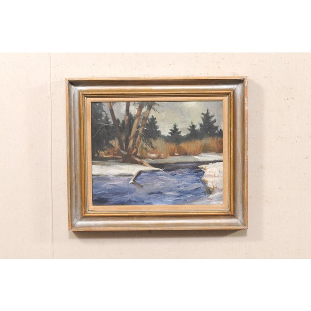 A framed winter landscape oil on canvas by David Hettinger (American, b. 1946), from the late 20th century. David P....