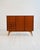 Scandinavian teak cabinet with mahogany interior. Four drawers, a drop-leaf compartment, and compartments with internal...