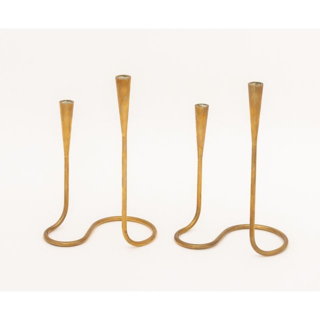Pair of Illums Bolighus Modernist Brass Candlestick Holders, each with two sconces conjoined by abstract base, marked to...