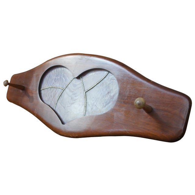 This hand made coat or hat hook/rack has a heart shaped cut out that has been filled with pink marbled stained glass and...