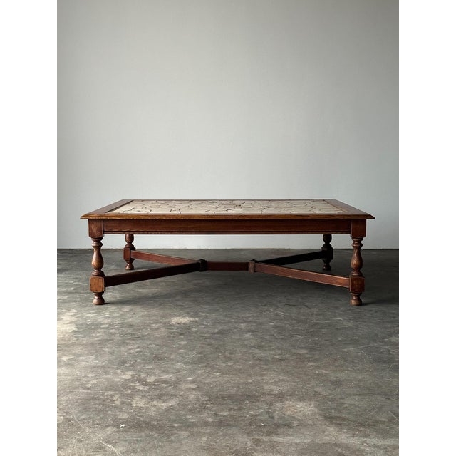 This one-of-a-kind coffee table is a genuine work of art. Each fragment of this mosaic top was set and grouted by hand,...