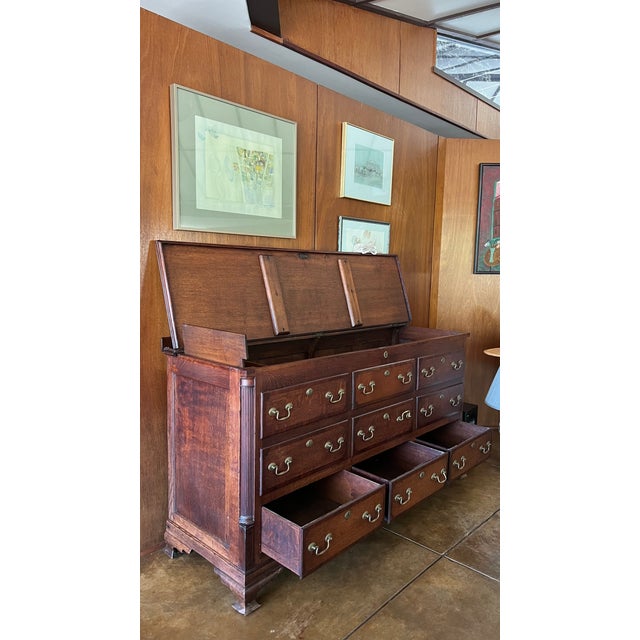 An exceptional late 18th-century English George III mule chest, expertly crafted in oak with richly figured mahogany...