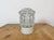Vintage industrial ceiling or wall light made in former Czechoslivakia during the 1970s. It features a white porcelain...