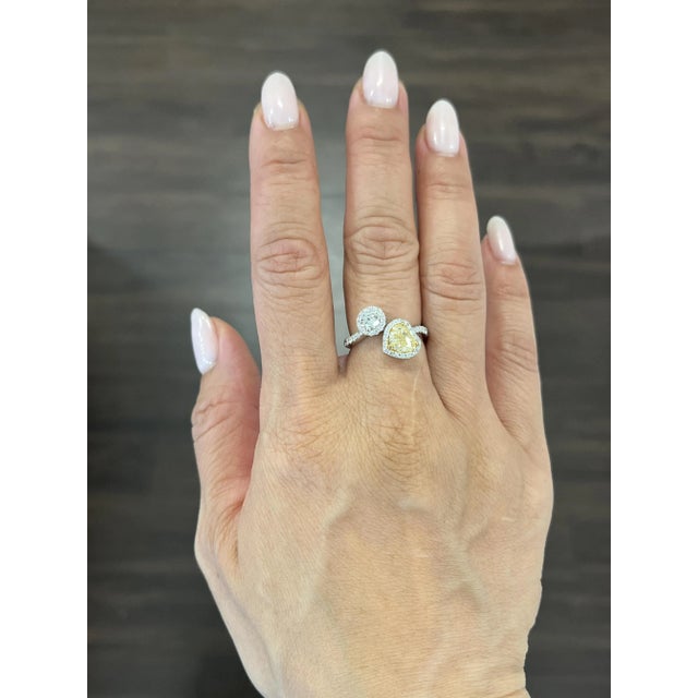 This gorgeous moi et toi diamond ring features a natural yellow heart shaped and round diamond on the ring. The natural...
