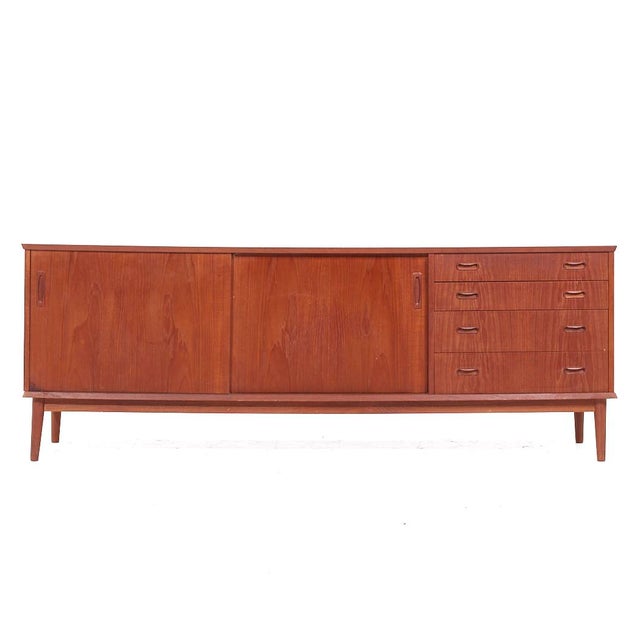 Arne Vodder Style Mid Century Teak Credenza This credenza measures: 79.25 wide x 18.25 deep x 29.25 inches high ABOUT...