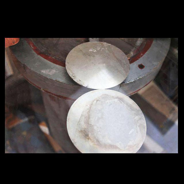 Custom round studio designed table. Vintage wooden cylindrical base, fabricated metal disc supports and round glass top.