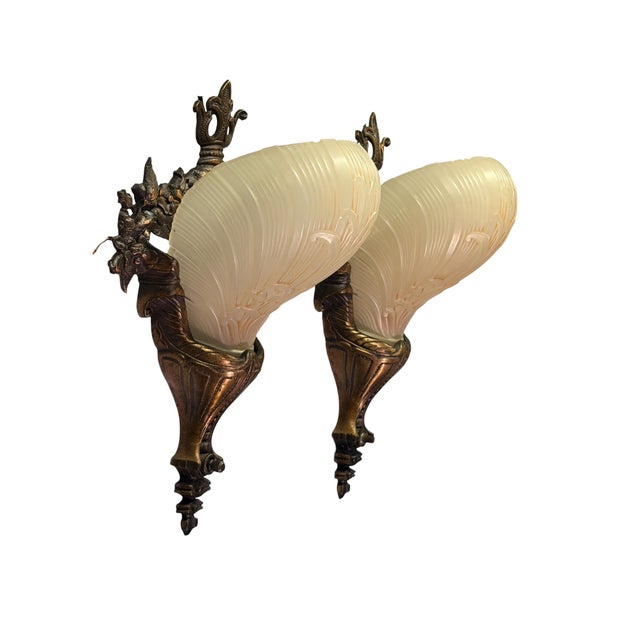 Really beautiful sconces with cast bronze frame and ivory slip shades. Hard to find design, and these are in beautiful...