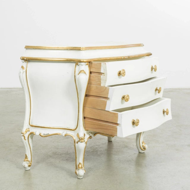 Elevate your space with the timeless allure of this 1960s Italian white patinated wooden chest of drawers. Radiating an...