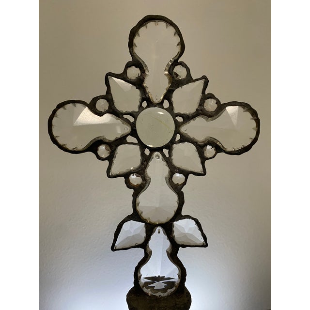 This one-of-a-kind assemblage sculpture combines a substantial clear cut-glass bottle with a handcrafted cross formed from...