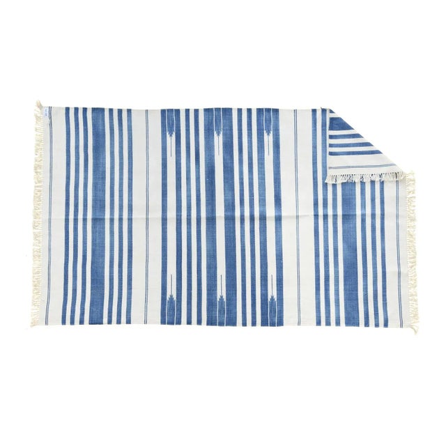 Made from naturally dyed 100% cotton yarn, these dhurrie rugs have been handwoven by skilled craftsmen in Jaipur. The age...