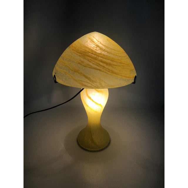 Art Nouveau Style Yellow Glass Mushroom Lamp Magnificent mushroom lamp made of yellow glass. Three leaves support the top...