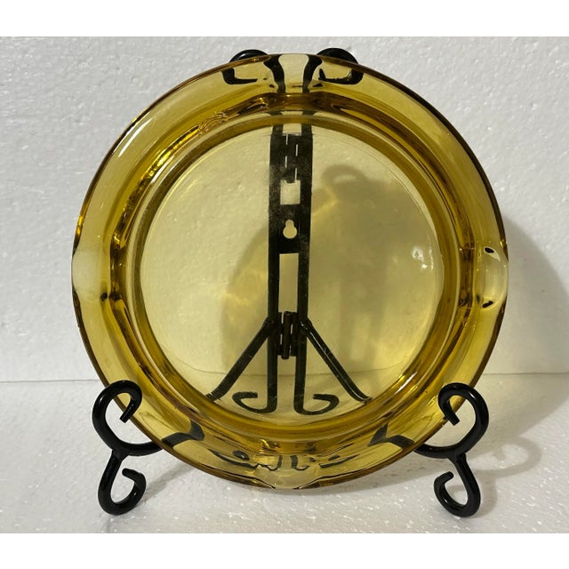 Heavy amber colored glass ashtray (or catchall) from the 1970s era. Four cigarette slots. 8” x 8” x 1”. Weight is 1 pound,...