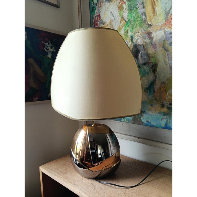 A master piece that has no equivalent. U unique amorfe formed lampfoot with gold- and silver plating. The lampshade is an...