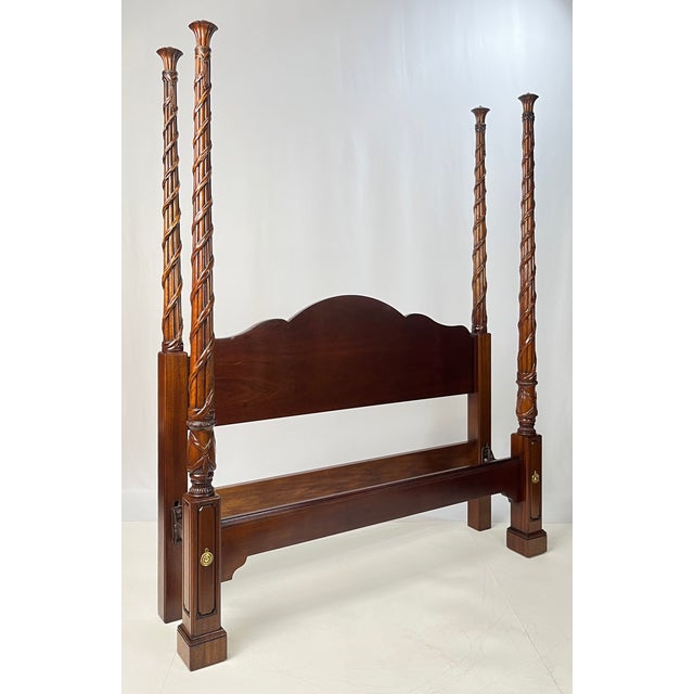 Vintage solid mahogany queen-size four-poster bed attributed to Hickory Chair Co., featuring their iconic Georgian...