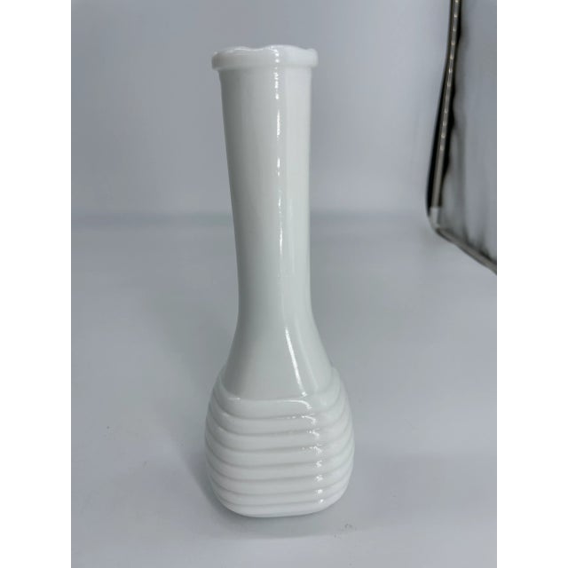 Milk glass vase on offer, with Art Deco-like design around the vase. We have seen many milk glass vases in our searches,...
