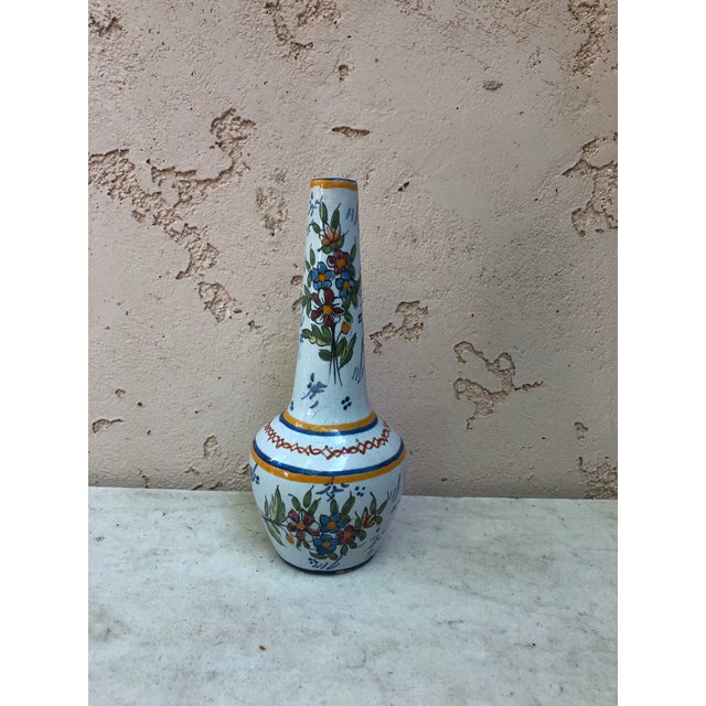 French Faience Vase signed HB Quimper Circa 1900. Decorated with flowers, a farmer from Brittany and Brittany symbol.