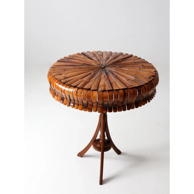 This is a beautifully constructed antique accent table. The bamboo slates create a spherical fan anchored in the center by...