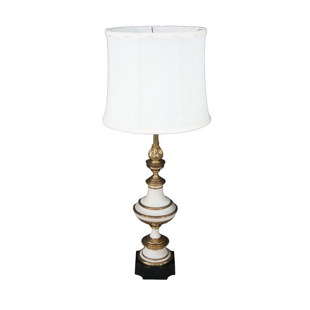 This pair of vintage mid-century Stiffel brass and enamel table lamps showcases the monumental, heavy-cast craftsmanship...