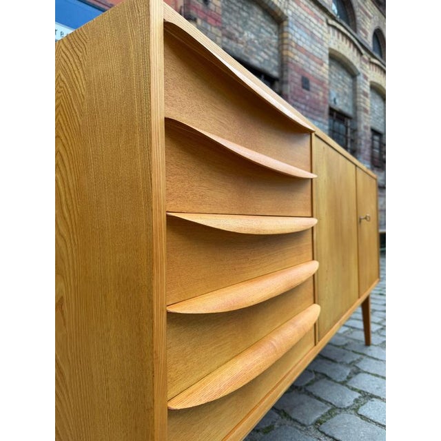 The elegant Type 602/K sideboard in ash was designed by the renowned Bauhaus student Franz Ehrlich and manufactured in the...