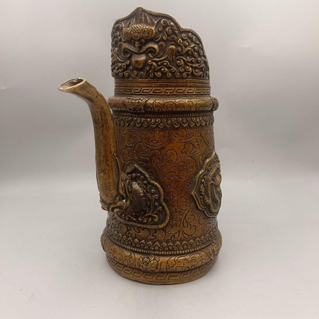 Add an air of ancient mystique to your home with this highly detailed, vintage-style brass ewer. This striking piece...