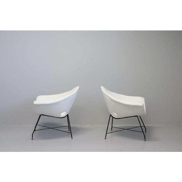 This rare pair of triangular living room chairs was designed by Augusto Bozzi and produced by Saporiti, Italy, in 1950....