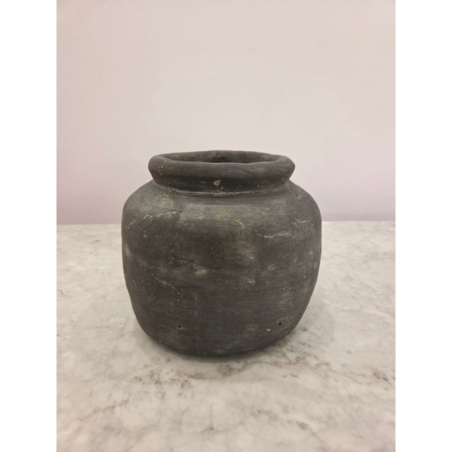 Medium sized asymmetrical circular vase, wide opening, charcoal grey with washed finish