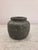 Medium sized asymmetrical circular vase, wide opening, charcoal grey with washed finish