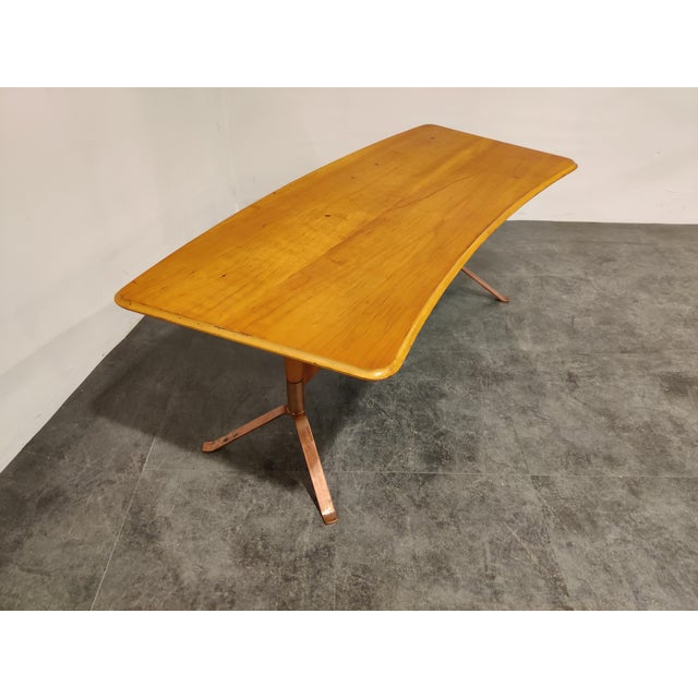 Midcentury curved coffee table made from pine wood and copper legs. Stamped underneath, but no manufacturer/designer could...