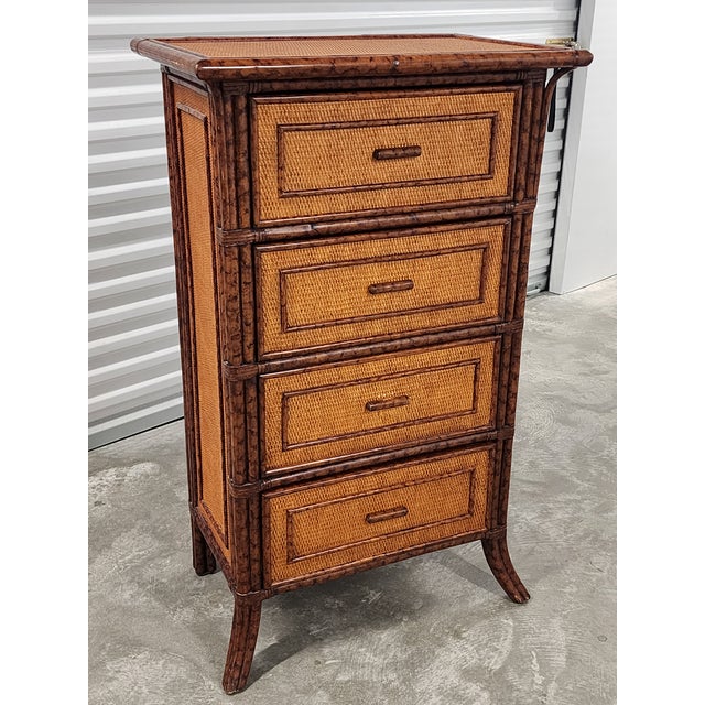 Vintage late 20th century faux tortoise bamboo and rattan chest of drawers in a warm honey finish. The chest features 4...