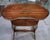 A two-tiered art nouveau tea table, featuring a light and refined silhouette characteristic of belle époque designs. the...