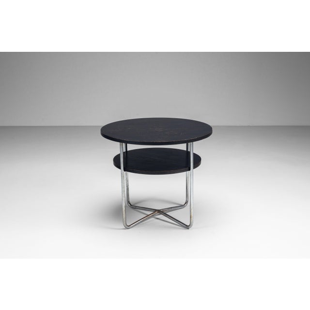 This round Thonet coffee table is a refined example of timeless modern design, balancing elegance with practicality. Its...