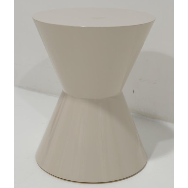 Minotti's Cesar's table in off-white shiny lacquer. Goes anywhere and perfect wherever you need a side table with style,...