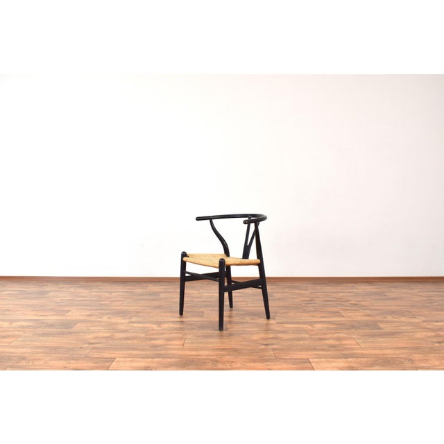This model CH24 Wishbone chair designed by Hans J. Wegner in 1949 and produced by Carl Hansen & Son in 1960s. It is an...
