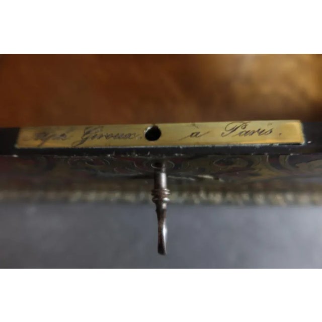 Louis XIV style box in marquetry style boule in brass on red flap background. The base and the lid of the lid are...