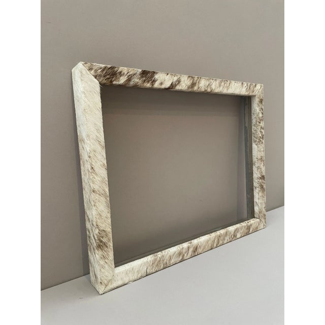 Genuine cowhide picture frame, hand made in Peru circa 2010. Never used. Artisan made. Frame is wood construction, wrapped...