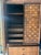 Tobago Brutalist Walnut Armoire / Wardrobe Cabinet — Mosaic Block Carved Doors, Made in Canada, c. 1960s–70s A commanding...