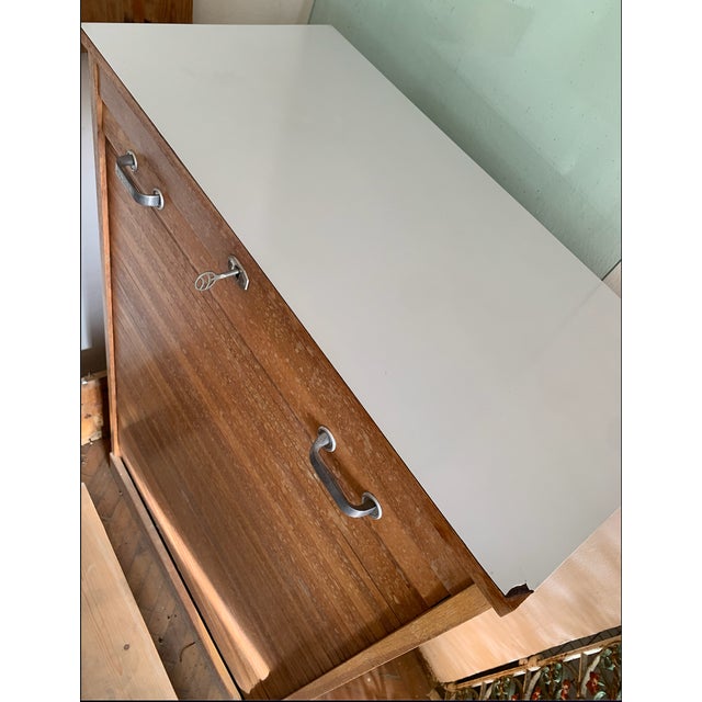 Very nice Art Deco roller shutter cabinet with 12 drawers. Fully functional roller shutter door, lockable with matching...