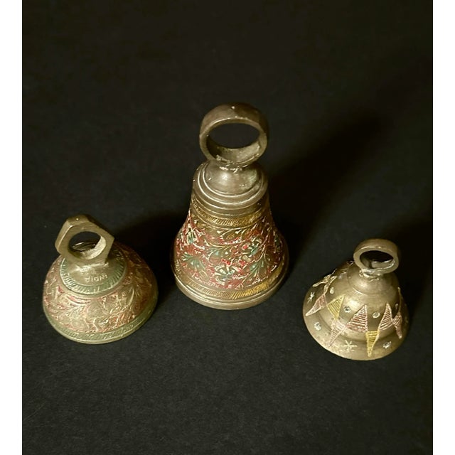 Trio of mid 20th century cloisonné brasss bells. Largest bell is 2” x 2” x 3 1/2”.