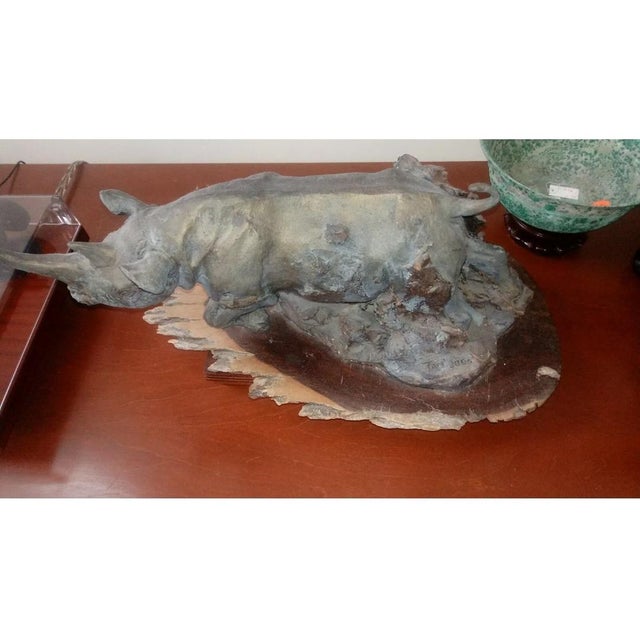 Rhino Sculpture by Tom Yssel. A beautiful Hard African Clay Sculpture By Thomas Yssel. The Patina Has developed over the...