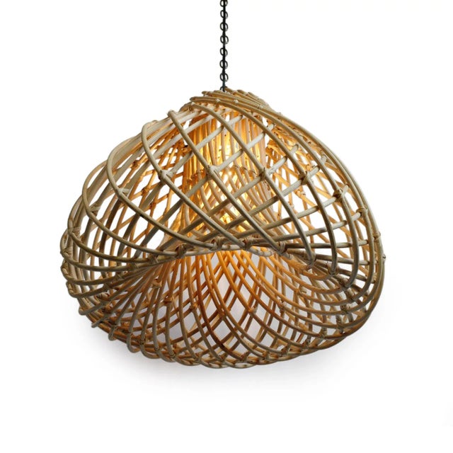 Beautiful thick rattan Java Drop hanging lantern. Attractive swirling design produces a natural glow when illuminated....