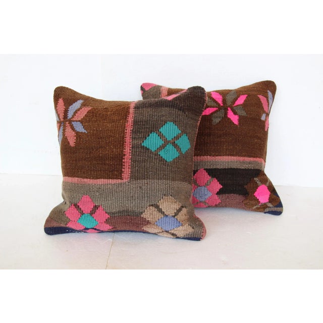 Pair of cushions made from a vintage handwoven Turkish kilim textile. Heavyweight cotton backs. Hidden zipper closures....
