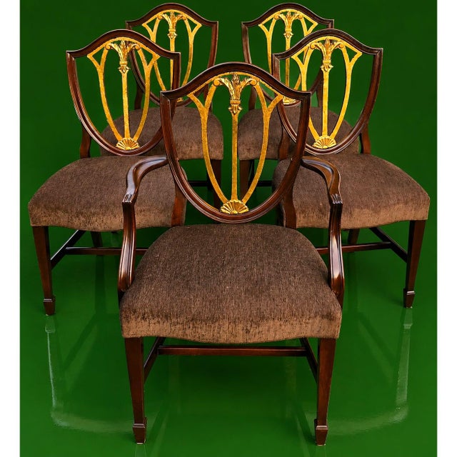 English Regency Revival Mahogany and Gilt Shield-Back Dining Chairs, Set of Five, Circa 1930 has depth and formality,...
