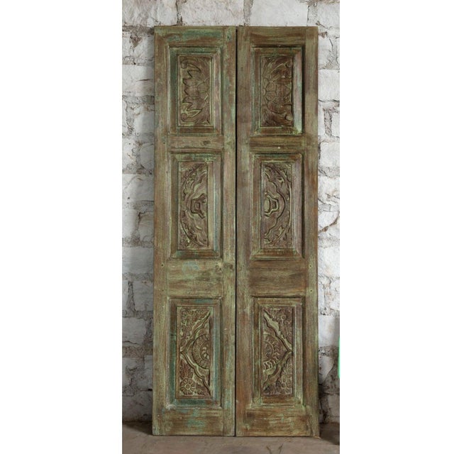 Transform your space with this vintage hand-carved double door, featuring an floral motif in a beautiful distressed green...