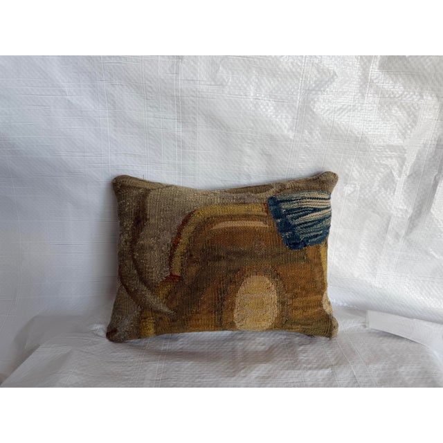 Fashioned from an authentic 17th-century Brussels tapestry, this antique pillow features an unusual fragmentary pattern...