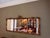 Has solid wood backing. This is an extra large horizontal ornate gold wall mirror designed in a French Baroque or Rococo...
