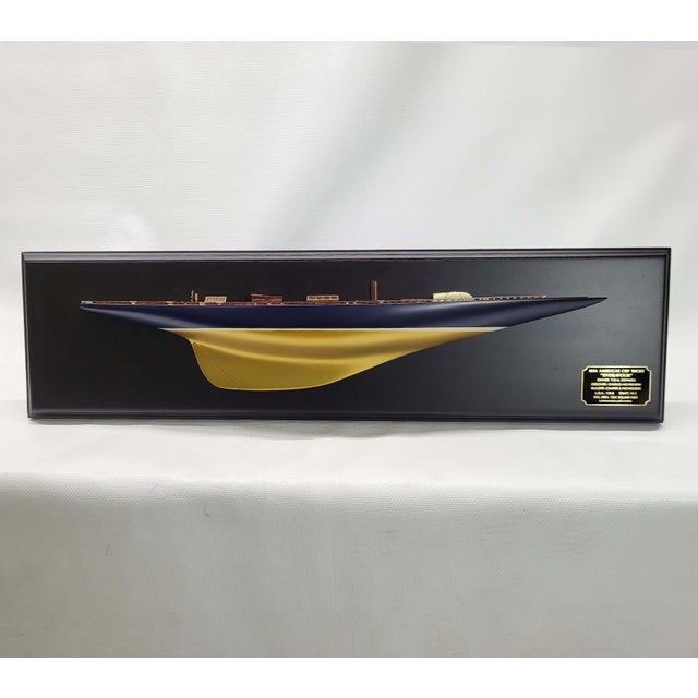 Fine half model of the 1934 America’s cup defending Yacht Endeavor. The model has a planked deck with Toe Rails, Hatch,...