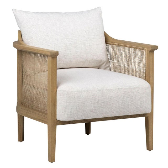 Modern coastal hand crafted Mindi wood arm chair with rattan caning detail and off-white upholstered seat and back pillow....
