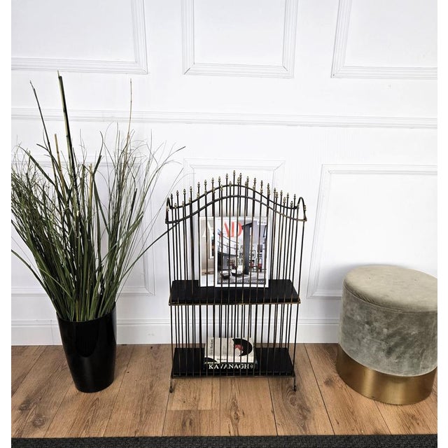 Beautiful and stylish Italian Mid-Century Modern magazine stand or folio rack dated around the 1950s with nice top brass...