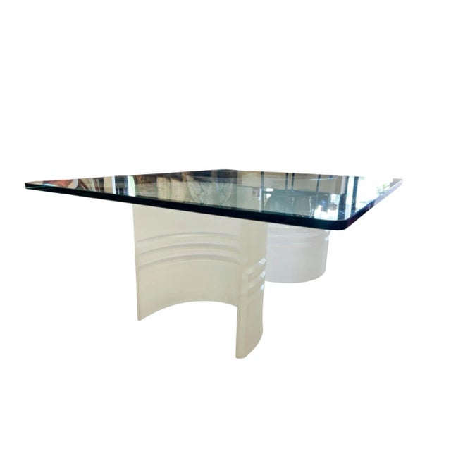 A Modern Lucite and Glass Cocktail Table. The table features a beveled glass top and a customizable base, allowing you to...
